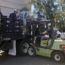 Special Services employees hauling boxes from Tupper Hall